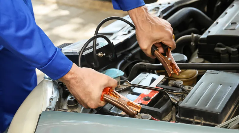 Man Testing Modern Car Battery_wp
